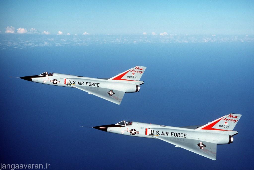 An air-to-air left side view of two F-106 Delta Dart aircraft from the 177th Fighter Interceptor Group, New Jersey Air National Guard, in formation during the air-to-air weapons meet WILLIAM TELL '84.