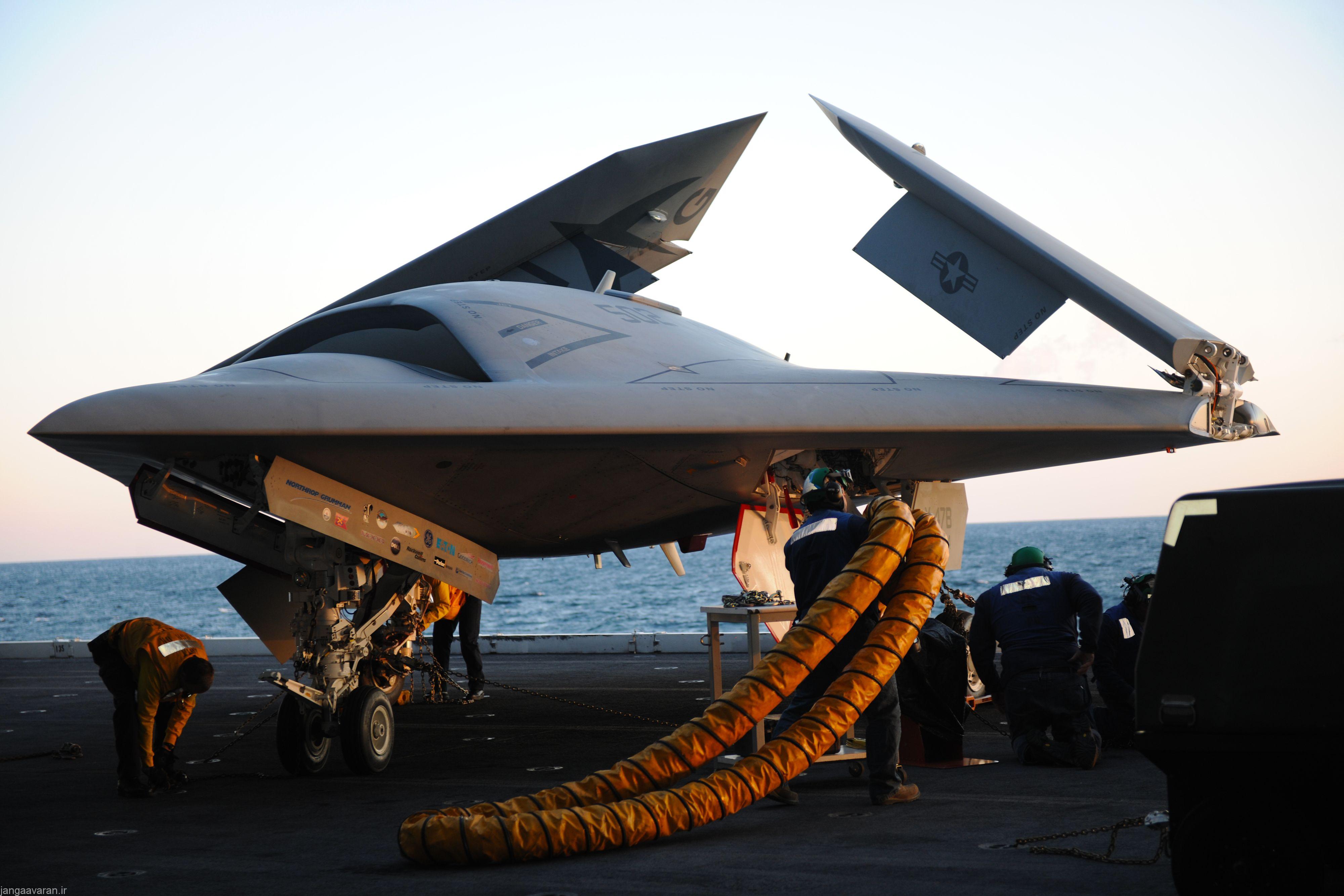 130514-N-CZ979-031 ATLANTIC OCEAN (May 14, 2013) An X-47B Unmanned Combat Air System (UCAS) demonstrator is loaded onto an aircraft elevator aboard the aircraft carrier USS George H.W. Bush (CVN 77). George H.W. Bush is scheduled to be the first aircraft carrier to catapult launch an unmanned aircraft from its flight deck. (U.S. Navy photo by Mass Communication Specialist Seaman Joshua Card/Released)