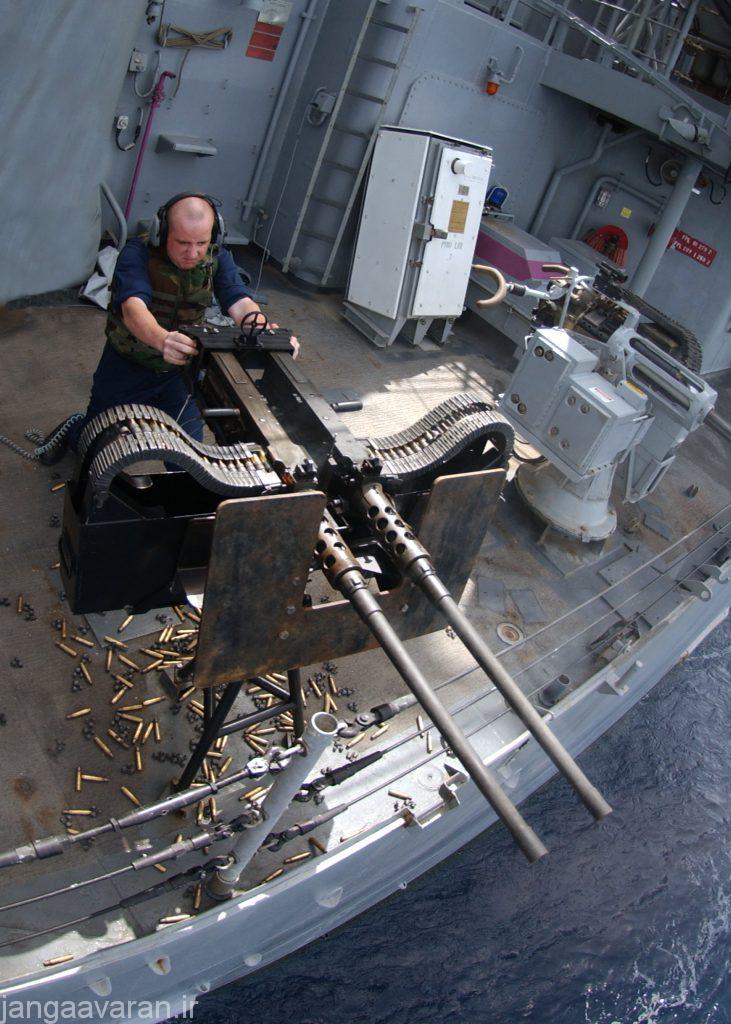 050514-N-5526M-012 Gulf of Aden (May 14, 2005) - Fire Controlman Steven Baumgartner from Oelwein, Iowa, assigned to Combat Systems Department aboard the guided missile cruiser USS Normandy (CG 60), fires the twin .50 caliber machine gun during a Pre-aimed Calibration Fire (PACFIRE) exercise. Normandy is currently conducting Maritime Security Operations (MSO), in the 5th Fleet area of responsibility. U.S. Navy photo by Photographer's Mate 1st Class Robert R. McRill (RELEASED)